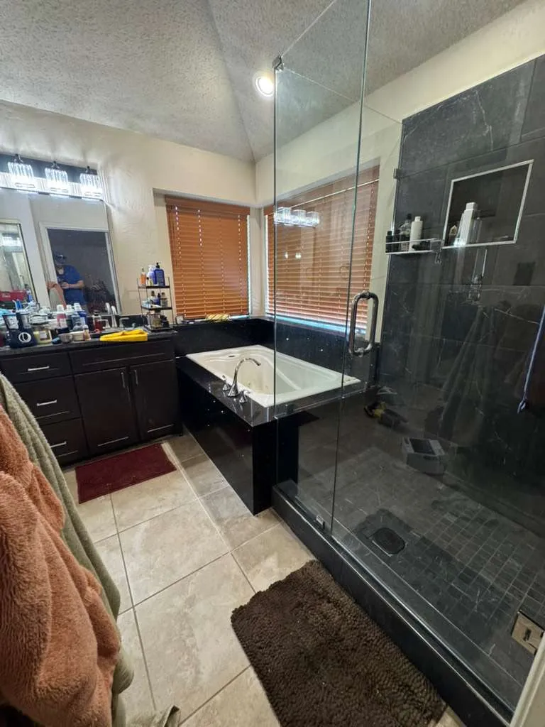After - custom floor-to-ceiling tile walk-in shower with frameless glass, Plano TX